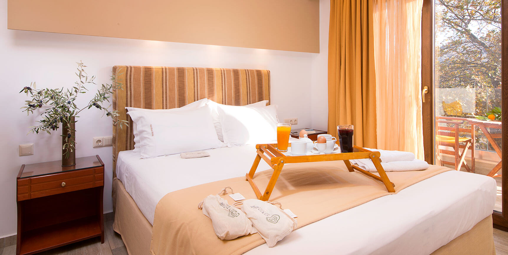 Bright studio bedroom with breakfast tray